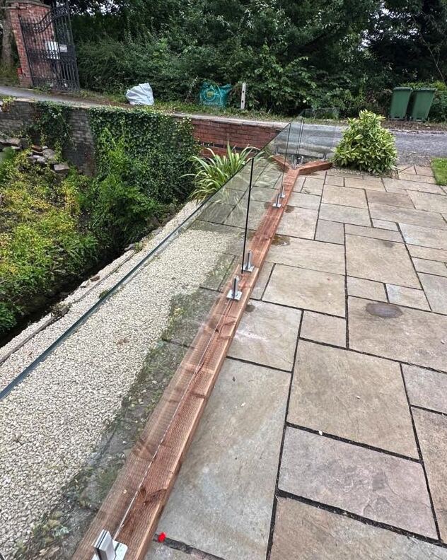 Glass balustrade & sandstone paving